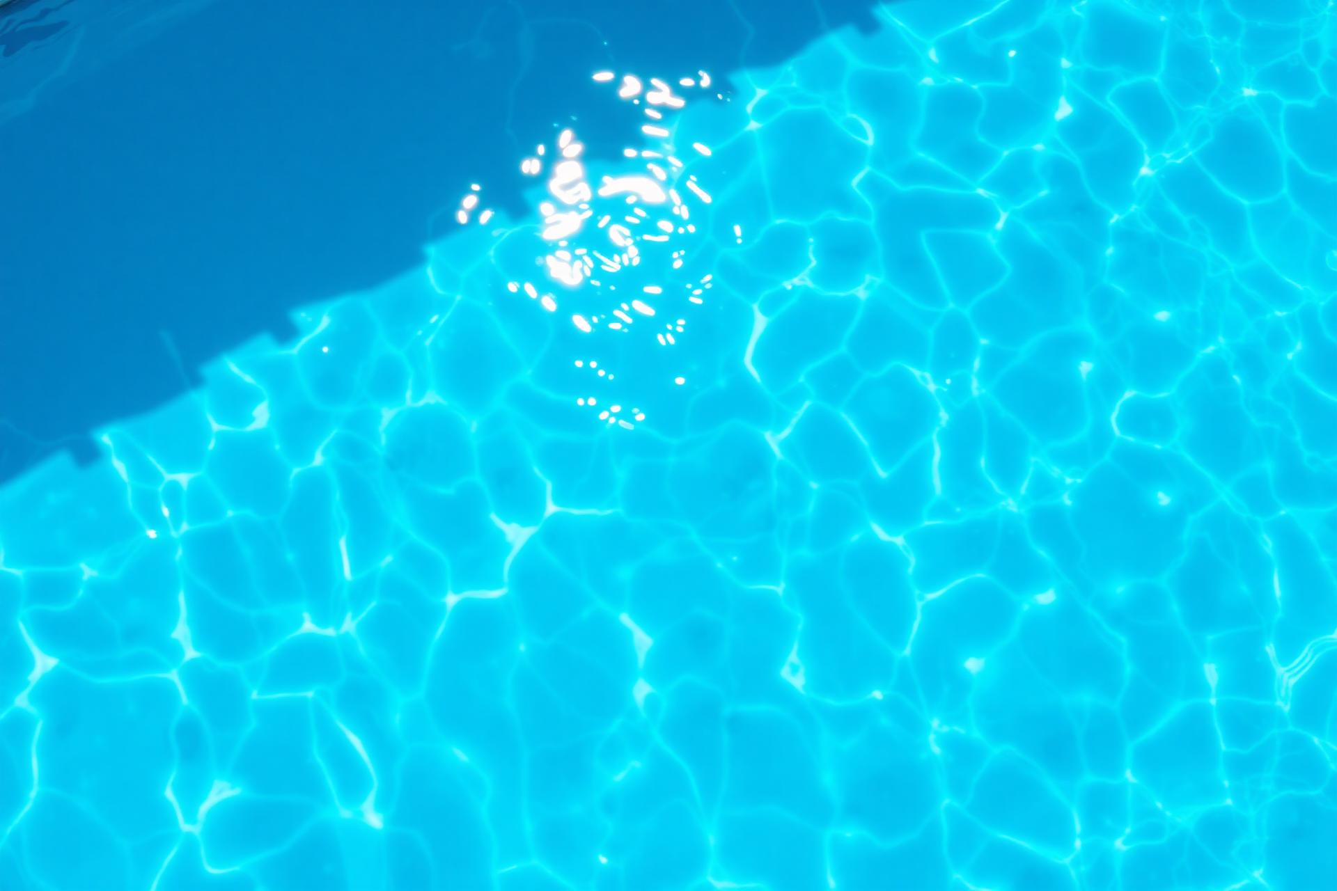 Crystal clear blue swimming pool water
